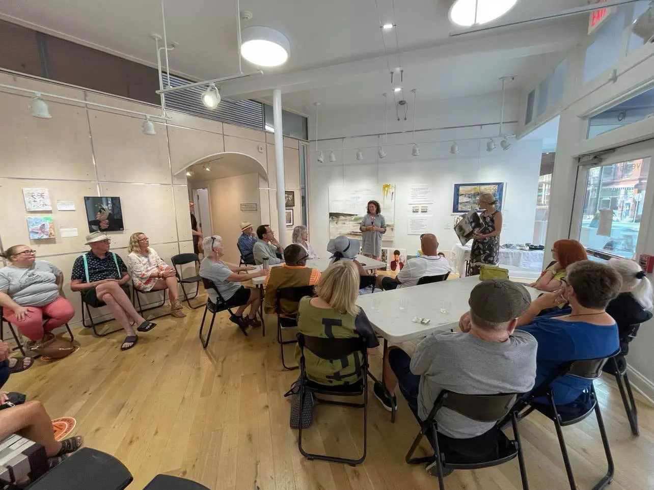 artists presenting to large group