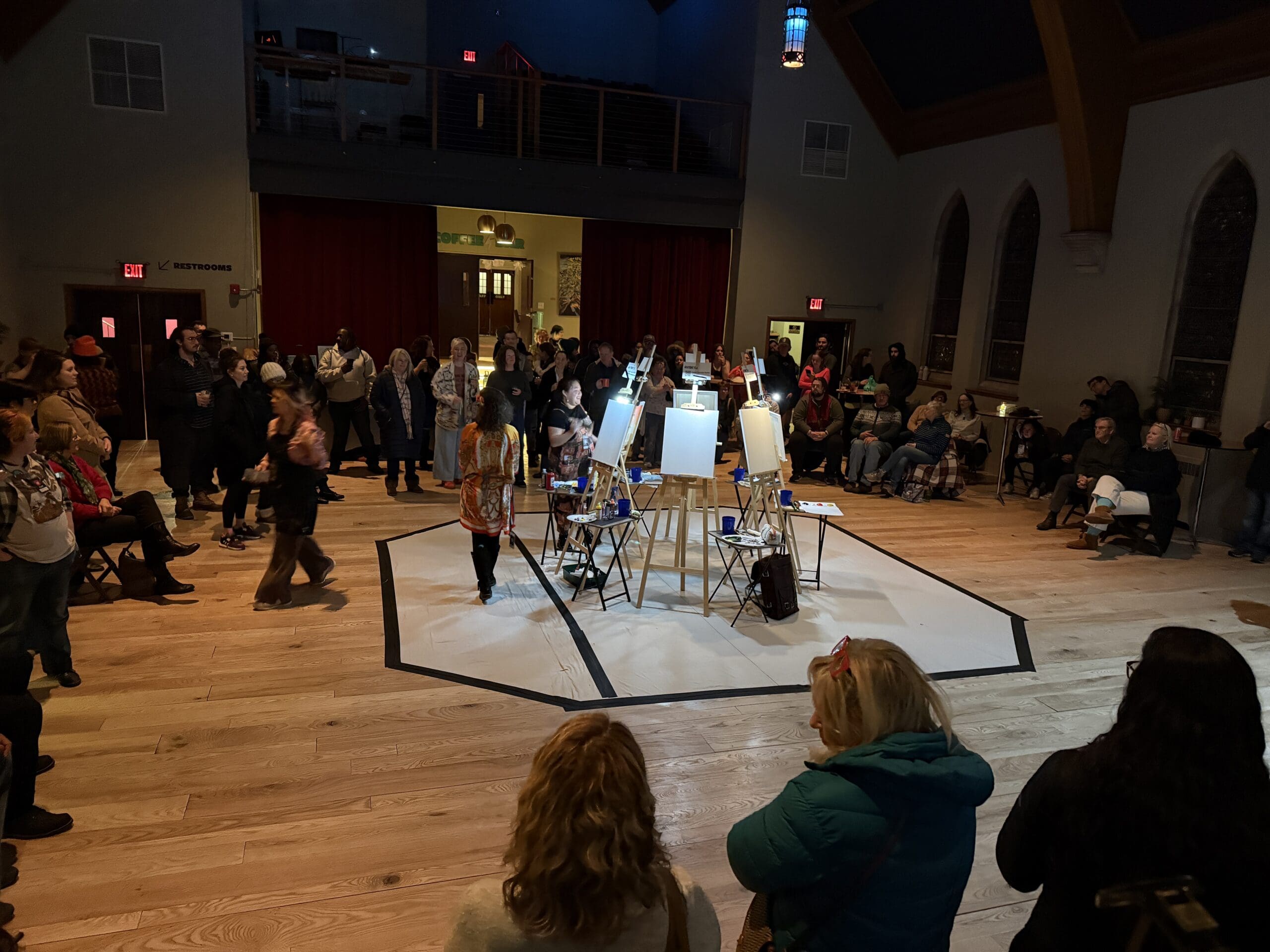 Image of blank canvases on easels in a circle