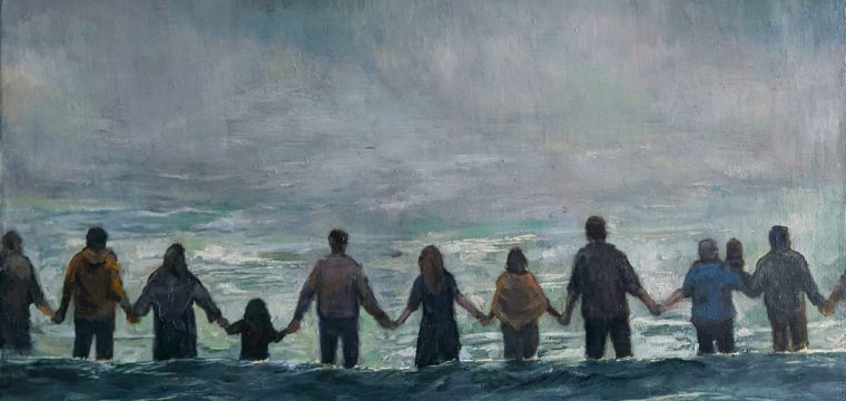people holding hands in front of wave